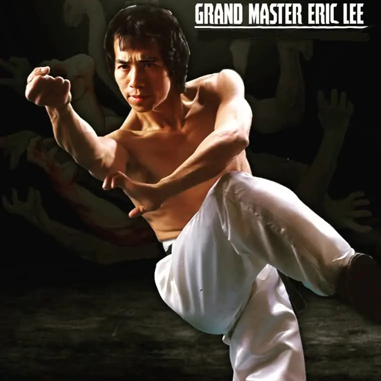 Grand Master Eric Lee performing a martial arts pose with intensity.